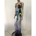 A shimmering floor-length sequin evening dress with a rainbow gradient in black purple green and gold for female singer costume