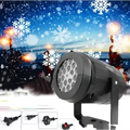 Black cylindrical led christmas projector lights with multiple circular light emitters and mounting bracket for snowflake patterns