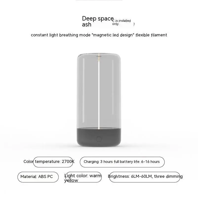 A sleek rechargeable portable night led camping light with a transparent upper body and black abs pc base