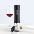 Black rechargeable usb electronic bottle opener with sleek cylindrical design and transparent lower section with silver handle