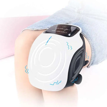 White and black rechargeable knee massager with digital display and soft silicone straps featuring sleek ergonomic design