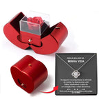 Red apple jewelry box with a clear acrylic drawer containing an eternal rose and red heart-shaped clavicle chain