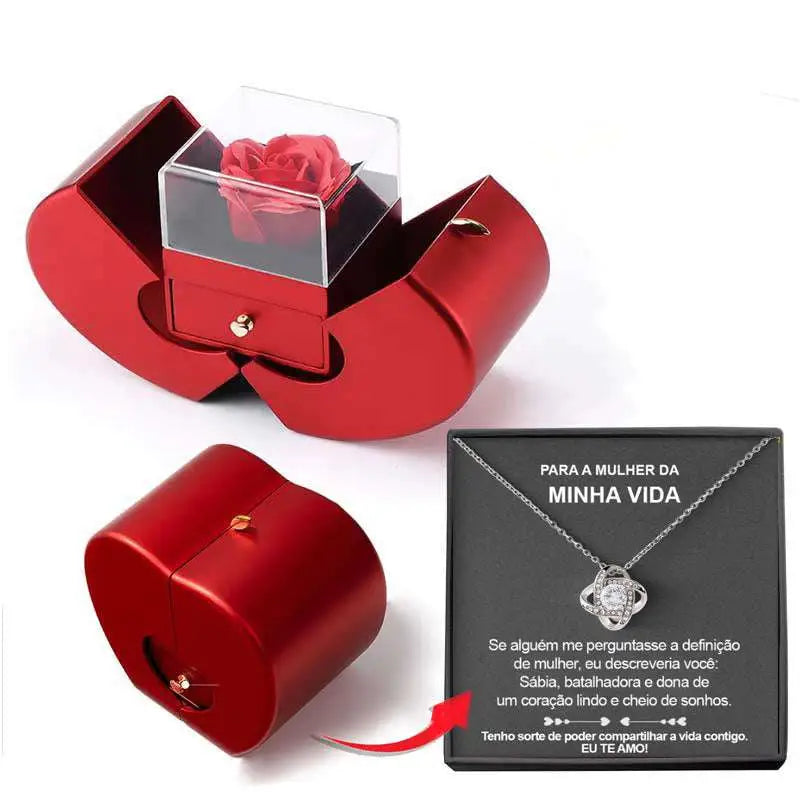 Red apple jewelry box with a clear acrylic drawer containing an eternal rose and red heart-shaped clavicle chain