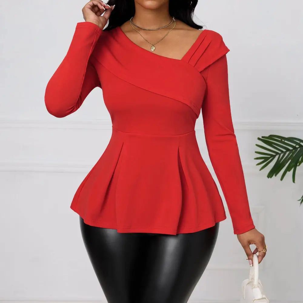 Red asymmetrical ladies fashion solid color peplum top with long sleeves, draped neckline, and pleated hem