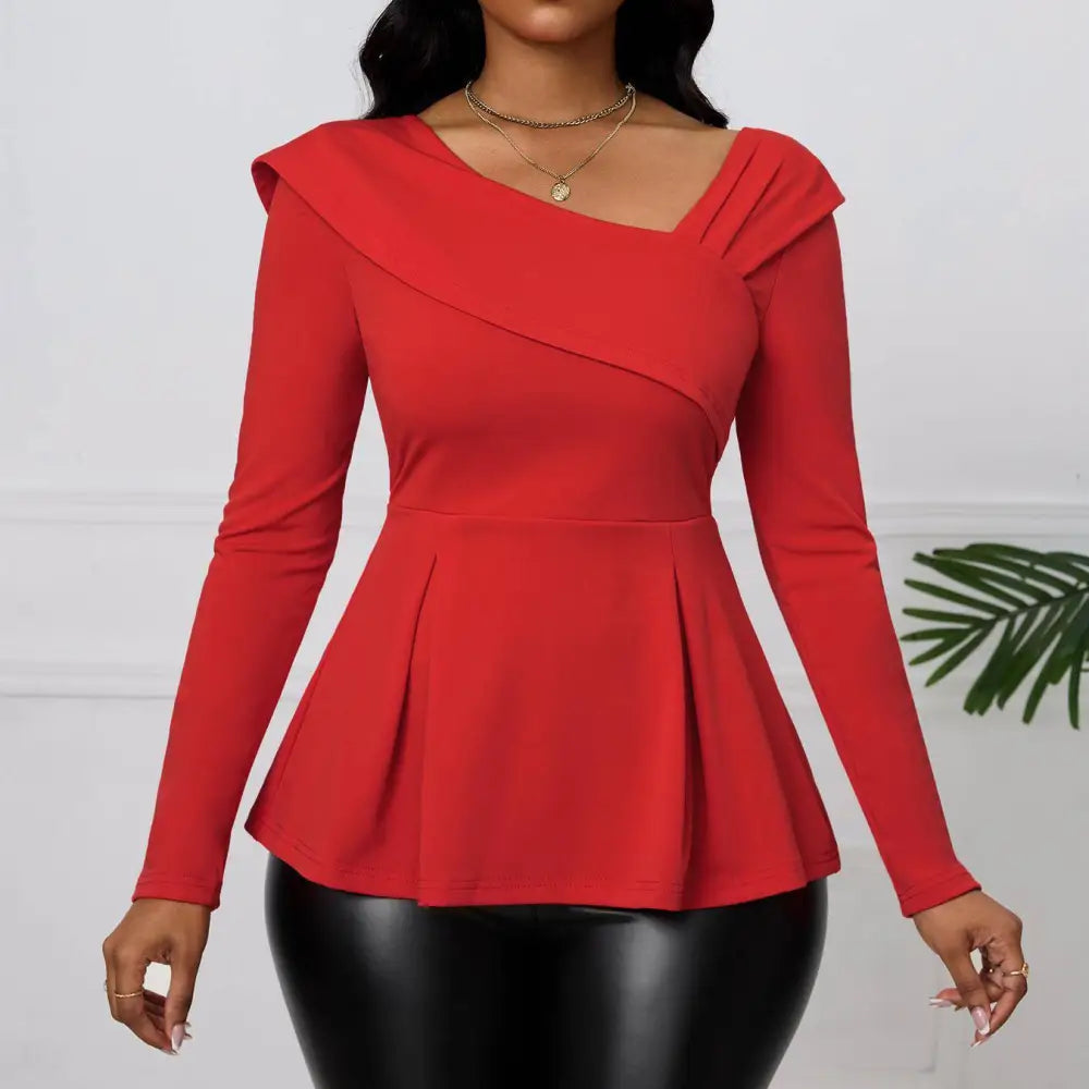 Red asymmetrical ladies fashion solid color peplum top with long sleeves, draped neckline, and pleated hem