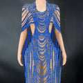 A dazzling royal blue sequin evening gown with intricate beaded celebrate crystal details and sheer mesh panels