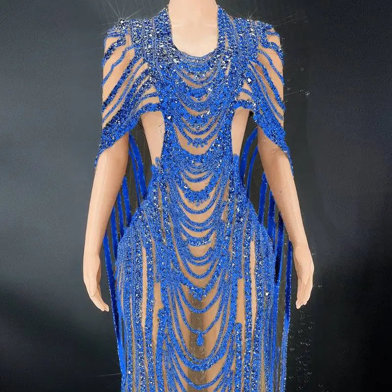 A dazzling royal blue sequin evening gown with intricate beaded celebrate crystal details and sheer mesh panels