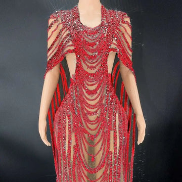 Red beaded celebrate crystal sequin evening gown with sheer mesh panels and dramatic shoulder straps in vibrant red