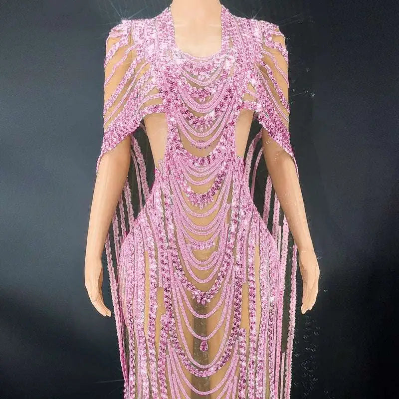 A shimmering pink sequin evening gown with beaded celebrate crystal details and sheer mesh panels for evening wear