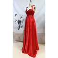 A vibrant red beaded satin temperament long banquet evening dress with a satin gown and ribbon ties at the shoulders