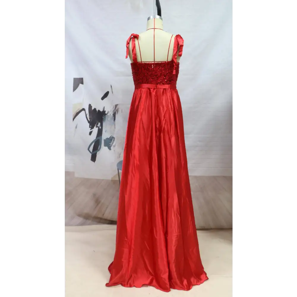 A vibrant red beaded satin temperament long banquet evening dress with sequined bodice and ribbon shoulder ties