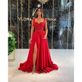 A vibrant red beaded satin temperament long banquet evening dress with sequined bodice and flowing satin skirt