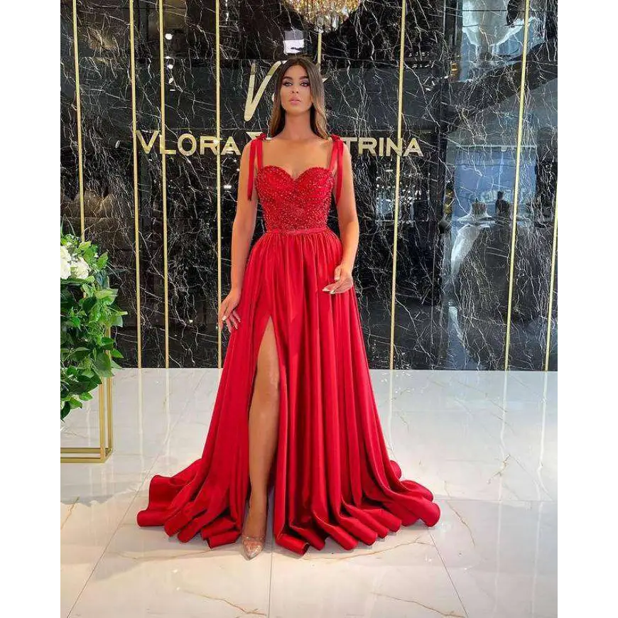 A vibrant red beaded satin temperament long banquet evening dress with sequined bodice and flowing satin skirt