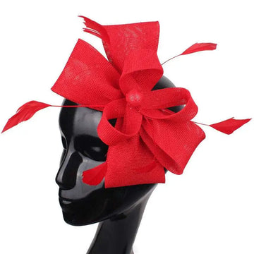 Vibrant red bow fascinator with large textured bow and feather accents for ladies banquet ball hair accessories