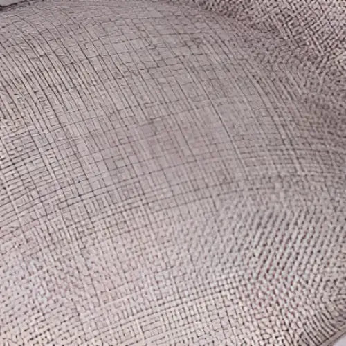 Beige linen-textured cushion with subtle woven pattern complementing red bow fascinator for ladies banquet ball with feather accents