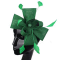 A vibrant emerald green ladies banquet ball fascinator with textured woven bow and delicate feather accents