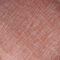 Textured dusty rose fabric with subtle diagonal weave on the back side of a red bow fascinator for ladies banquet ball