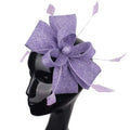 A lavender woven fascinator with a large bow and feather accents for ladies banquet ball hair accessories