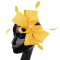 A vibrant yellow ladies banquet ball fascinator with textured fabric bow and delicate feather accents