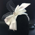 Elegant ivory satin wedding satin headband with delicate lace veil and sparkling crystal bow fashion bridal embellishment