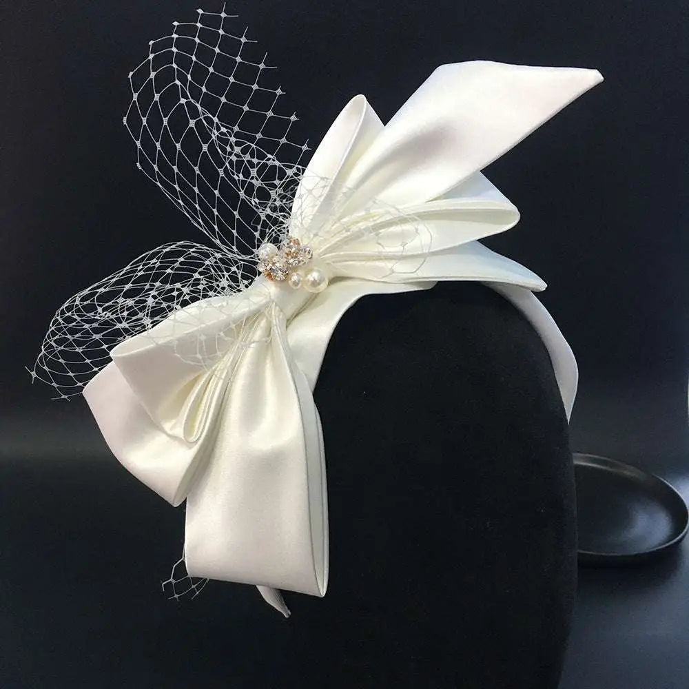 Elegant ivory satin wedding satin headband with delicate lace veil and sparkling crystal bow fashion bridal embellishment