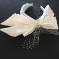 Ivory satin wedding satin headband with a large layered bow and fine lace veil for bow fashion bridal wear