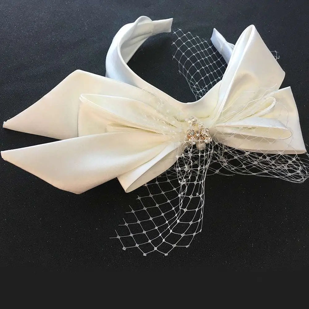 Ivory satin wedding satin headband with a large layered bow and fine lace veil for bow fashion bridal wear