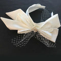 Elegant ivory satin bow fashion bridal wedding satin headband adorned with delicate lace and gold embellishment