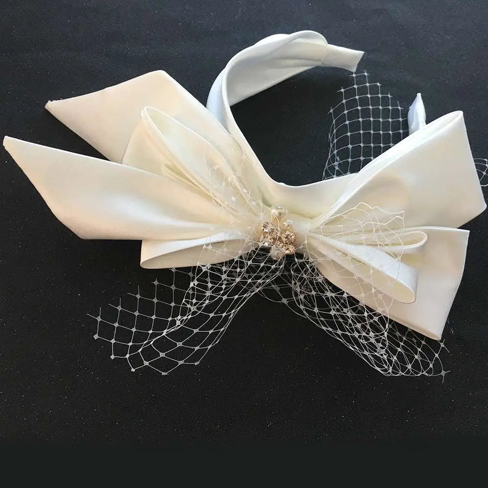 Elegant ivory satin bow fashion bridal wedding satin headband adorned with delicate lace and gold embellishment
