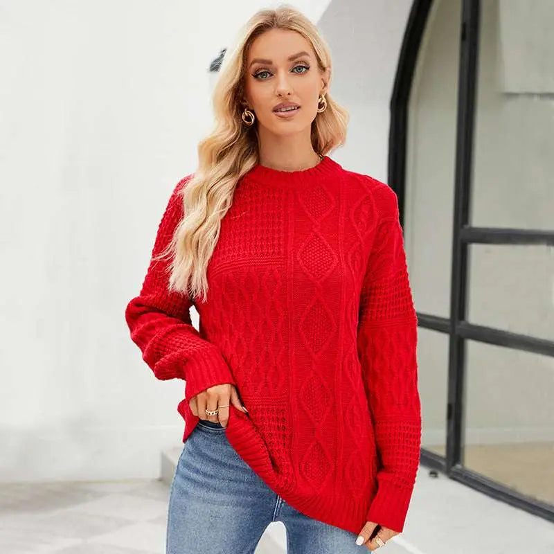 A vibrant red cable knit pullover sweater with long sleeves and a ribbed crew neckline for fall winter wear