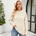 Cream-colored cable knit pullover sweater with long sleeves and ribbed cuffs ideal for fall winter wear