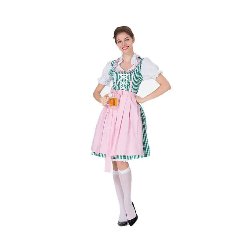 A woman wearing a checkered dirndl dress with green and white bodice and pink skirt for german beer festival clothing