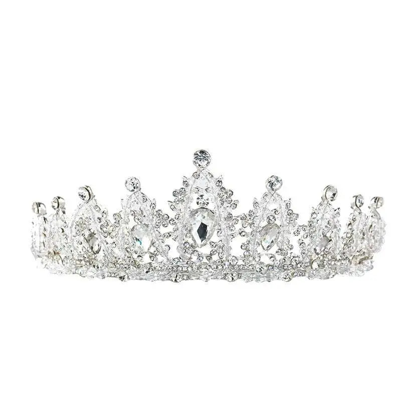 A sparkling silver crystal alloy crown with clear crystals and filigree detailing for crown wedding accessory