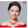 Red crystal bridal tiara with intricate floral design made from crystals for clothing accessories wholesale use
