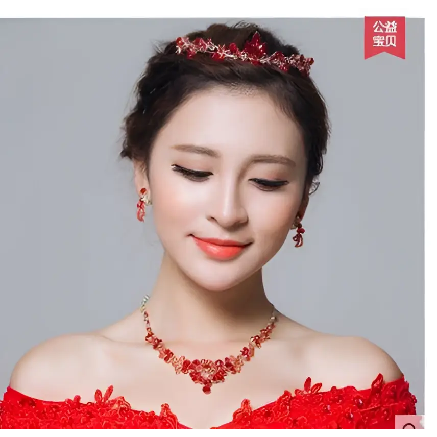 Red crystal bridal tiara with intricate floral design made from crystals for clothing accessories wholesale use