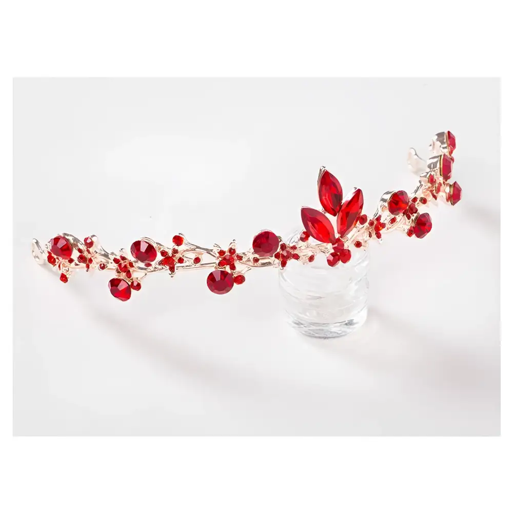 A delicate silver vine headpiece with vibrant red gemstones and leaf accents for red crystal bridal jewelry wholesale