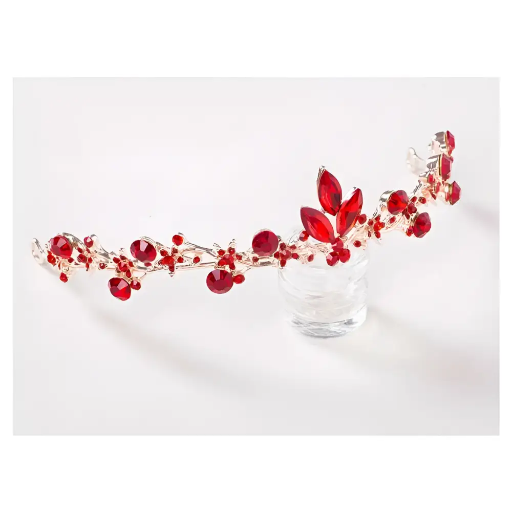 A delicate silver headband with vibrant red gemstones and leaf accents for red crystal bridal jewelry wholesale
