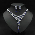 Elegant royal blue zircon necklace set with v-shaped design, red crystal leaf motifs, and teardrop pendants