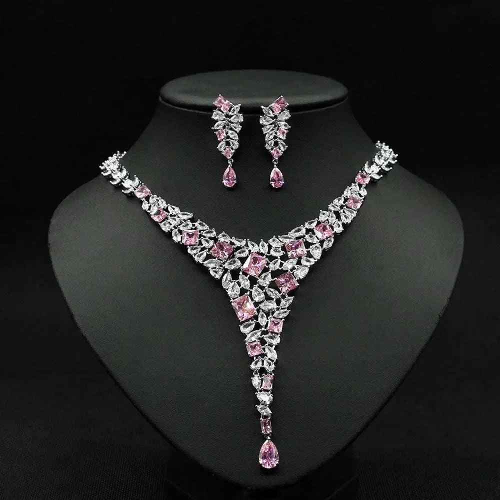Elegant pink and clear crystal zircon necklace set with v-shaped design featuring square-cut stones and teardrop pendants