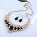 Gold-toned necklace with black teardrop stones and clear crystals in an ornate design for red crystal teardrop american jewelry fashion