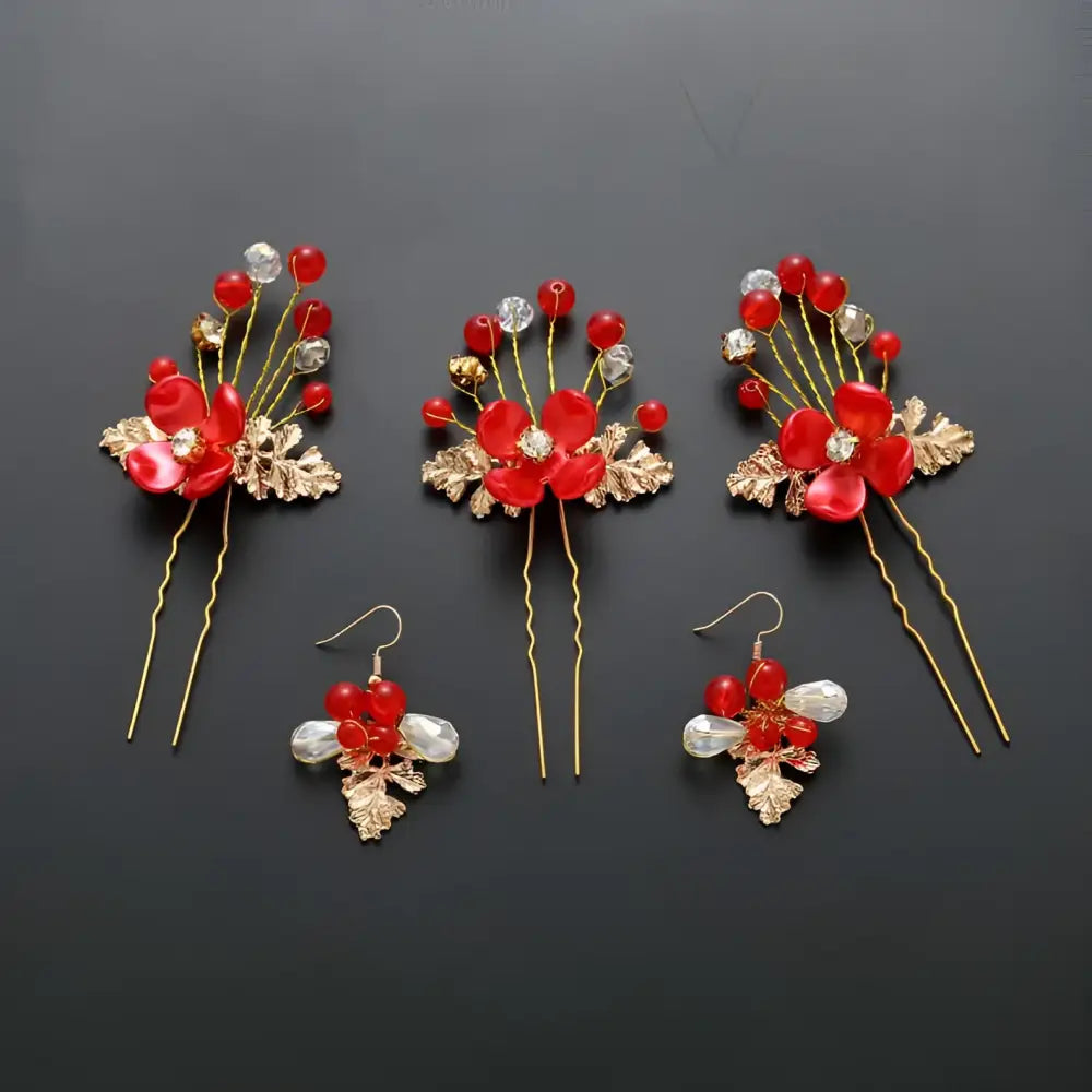 Red floral costume jewelry set with three hairpins featuring gold leaf accents and crystal beads with matching earrings for wedding
