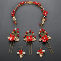 Red floral costume jewelry set with gold-toned leaves and crystal accents ideal for bridal or wedding use