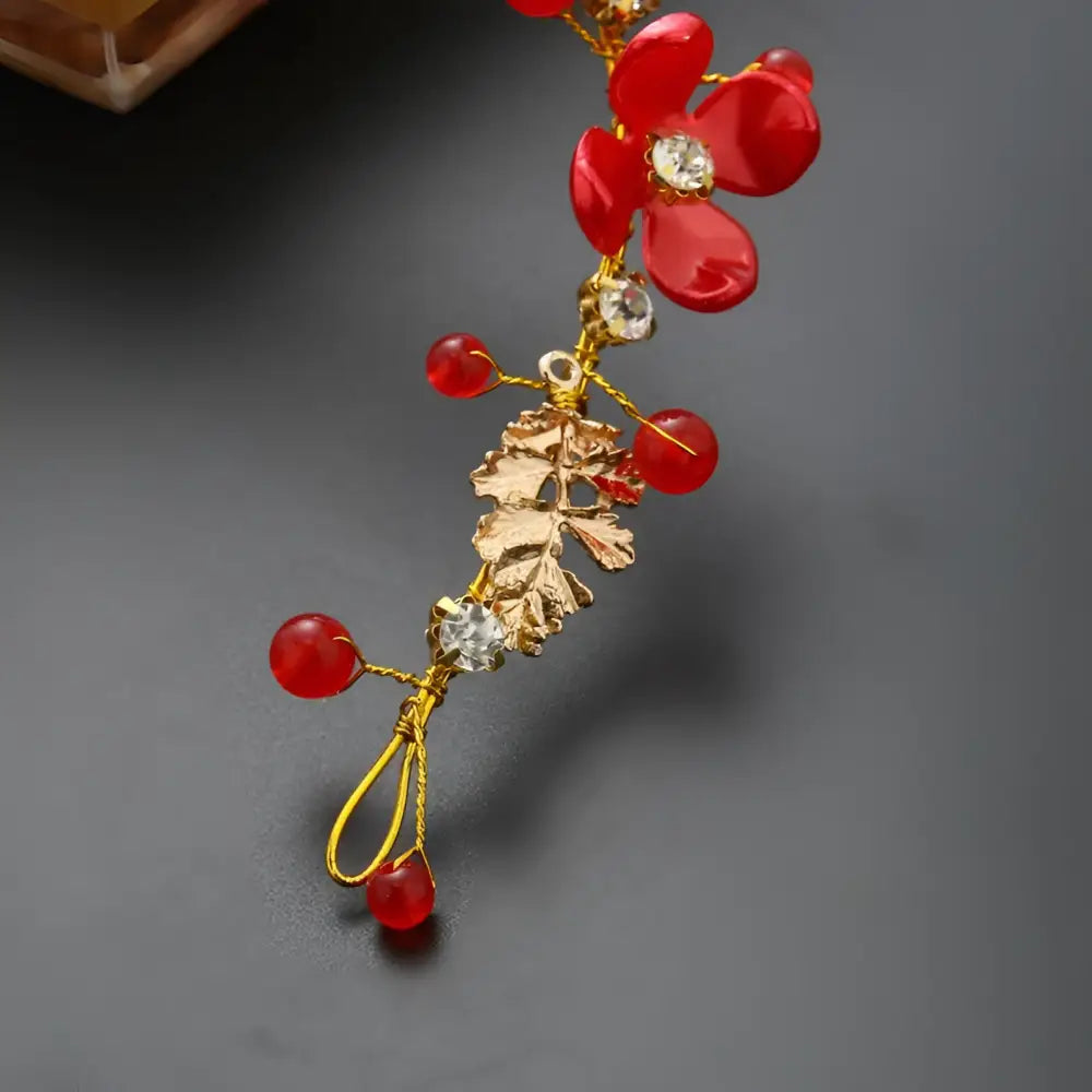 A delicate red and gold floral costume jewelry set with clear crystals and glossy red beads for jewelry set wedding
