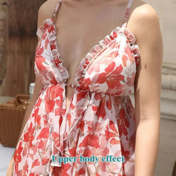 A flowing red floral ruffled fashion simple dress with white print, ruffled straps, and a gathered bodice