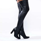 Black over-the-knee boots with glossy leather finish and block heels featuring a pointed high heel design