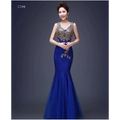 A royal blue fish tail banquet evening dress with intricate red gold beaded lace and embroidery detailing