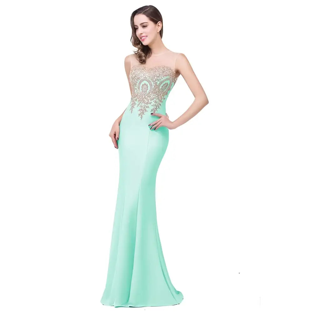 A mint green mermaid-style skirt evening gown with a red gold beaded bodice and thin straps