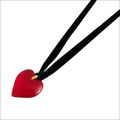 Glossy red heart pendant on a black velvet cord showcasing a red black sash black sash necklace design