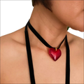 A glossy red heart pendant on a black velvet choker black sash necklace in red black sash style
