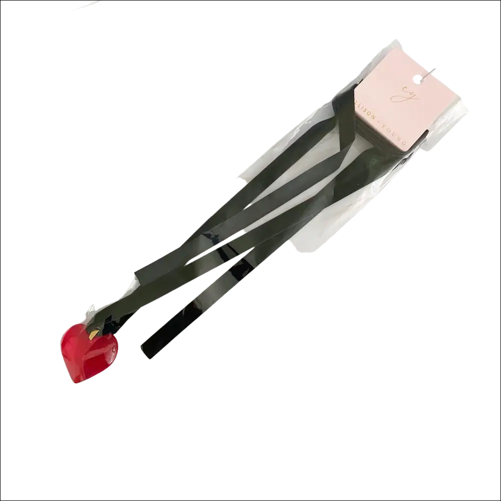Red heart black sash necklace featuring a heart-shaped charm on a black ribbon with pink tag packaging